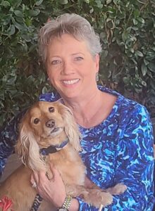Marcia (white woman) with brown furry dog
