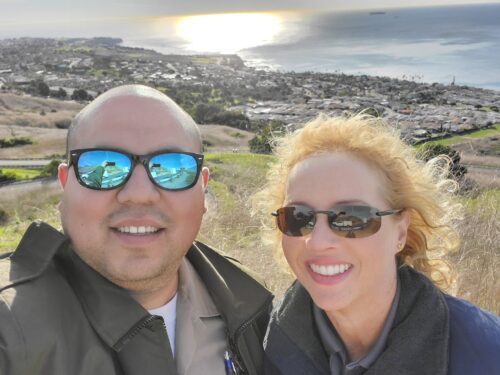 A selfie of Director of DACC Marcia Mayeda and Animal Control Officer Art Menchaca at Palos Verdes Peninsula, a wealthy and beautiful area of Los Angeles County